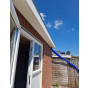 huis bekleed met kunststof keralit dakrand boeideel wit